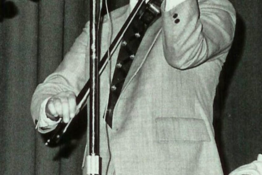<div class="small-image">Buddy MacMaster performing at the Highland Games in Antigonish in 1980.</div>