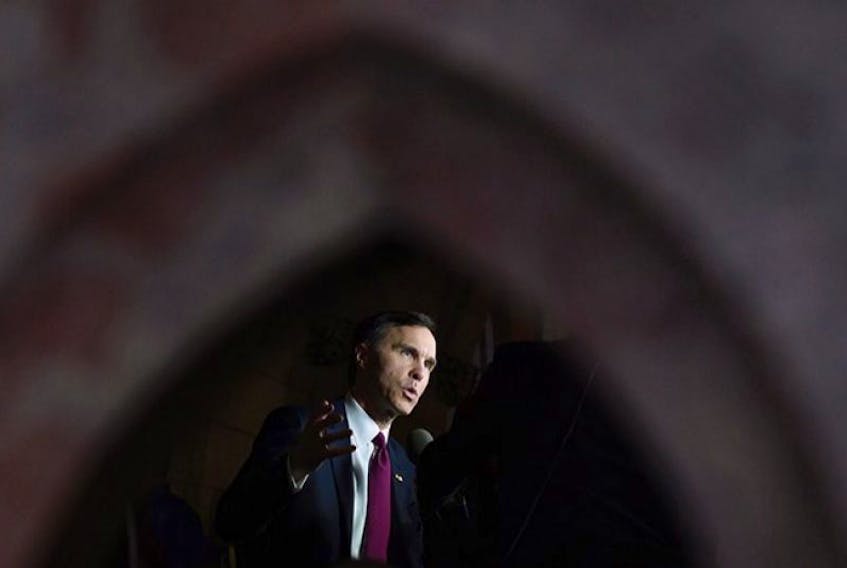 Minister of Finance Bill Morneau takes part in media interviews in the foyer of the House of Commons after delivering the federal budget on Parliament Hill in Ottawa on Tuesday, March 22, 2016.