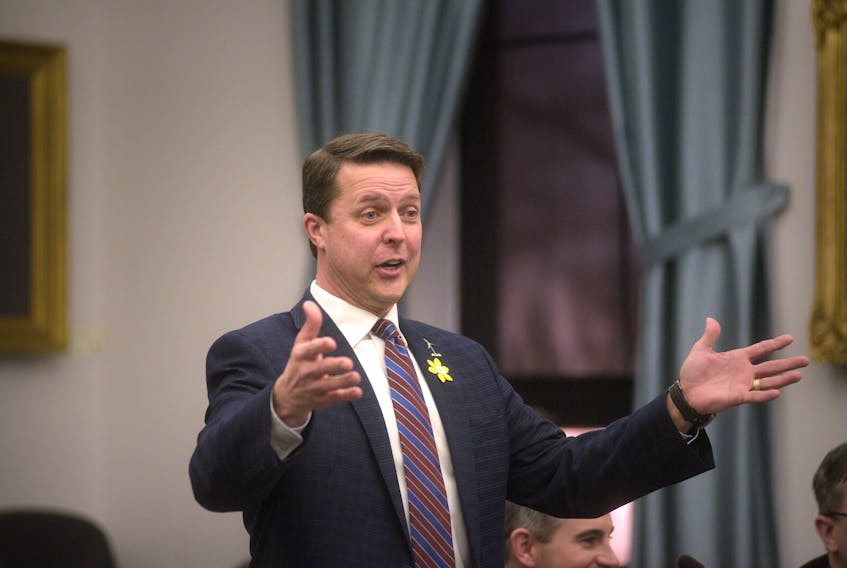 Brad Trivers, Progressive Conservative finance critic, gestures while responding to the release of the provincial budget in Charlottetown on Friday.