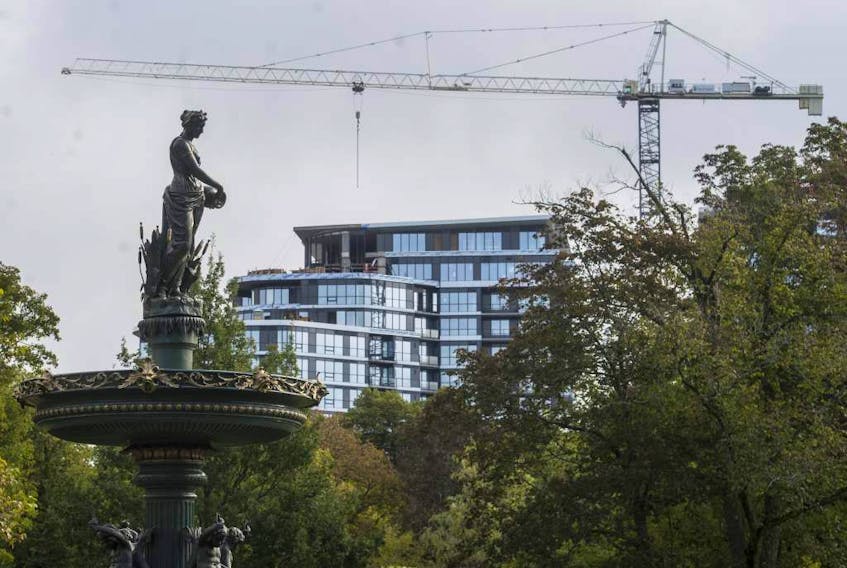 The John W. Lindsay YMCA, under construction, is seen behind the Victoria Jubilee Fountain in the Halifax Public Gardens, in September. New construction across the province is driving an increase in the property assessment roll.