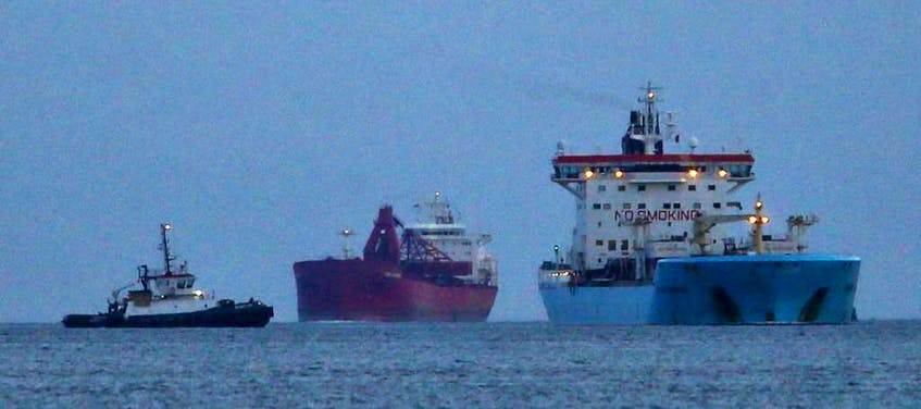A couple of bulk carriers enter Halifax Harbour on April 18, 2018.