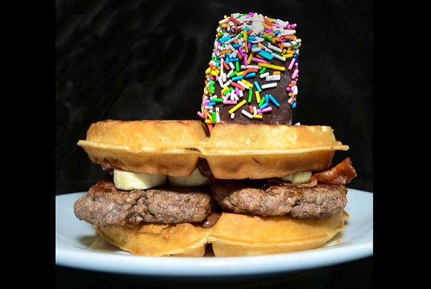 P.E.I. Burger Love participat Frosty Treat's <em><strong>Go Bananas</strong></em> burger consists of two - 5oz Island Beef Patties, Hazelnut Chocolate Spread, Sliced Fresh Bananas, Maple Syrup, and Bacon on a Belgium Waffle, topped with a Homemade Ice Cream Pop.