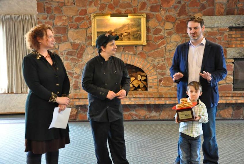 <p>The Old Orchard Inn in Greenwich won the inaugural Burger Wars competition hosted in the Annapolis Valley throughout the month of April. Campaign for Kids representatives Laura Churchill Duke, Andy Forse and five–year-old Eli Forse surprised Old O chef Joe Gillis with a Burger Wars trophy May 6.</p>