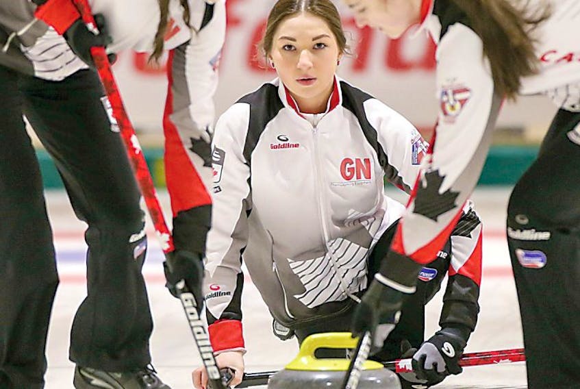 <span class="Normal">Karlee Burgess delivers a stone during playoff action at the women's world junior curling championship in Denmark. Burgess and her Team Canada teammates won the gold medal at the 10-team event.</span>