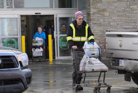 Shoppers leave Sobeys supermarket on Old Placentia Road on Monday, after the City of Mount Pearl lifted its state of emergency. People flocked by the hundreds to various retail outlets in the city to pick up groceries and other necessities. Joe Gibbons/The Telegram