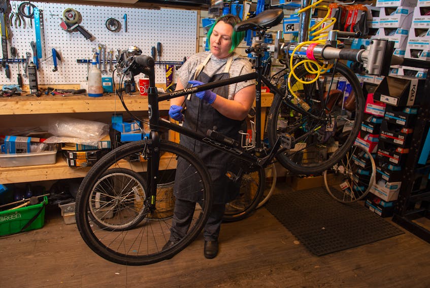 Jenna Molenaar, co-owner of Halifax Cycles & Guitars, works on a bike inside her Kempt Road shop on Thursday, May 7, 2020. Bike shops are bustling with people buying new bikes and getting their old bikes fixed up.
Ryan Taplin - The Chronicle Herald