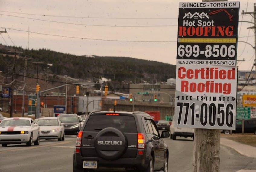 A commercial sign on a utility pole in St. John’s. A new bylaw means the city will soon be able to remove such signs without notifying the owners. -TELEGRAM FILE PHOTO