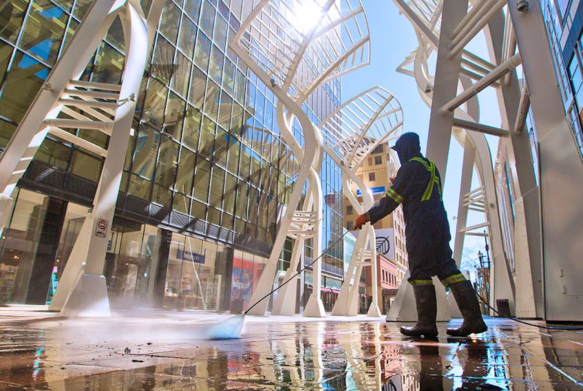 Stephen Avenue Mall gets a high pressure wash on Sunday, May 24, 2020. As part of the relaunch of Calgary's economy, hair stylists, barbers and sit down restaurants are now allowed to reopen with COVID-19 precautions.