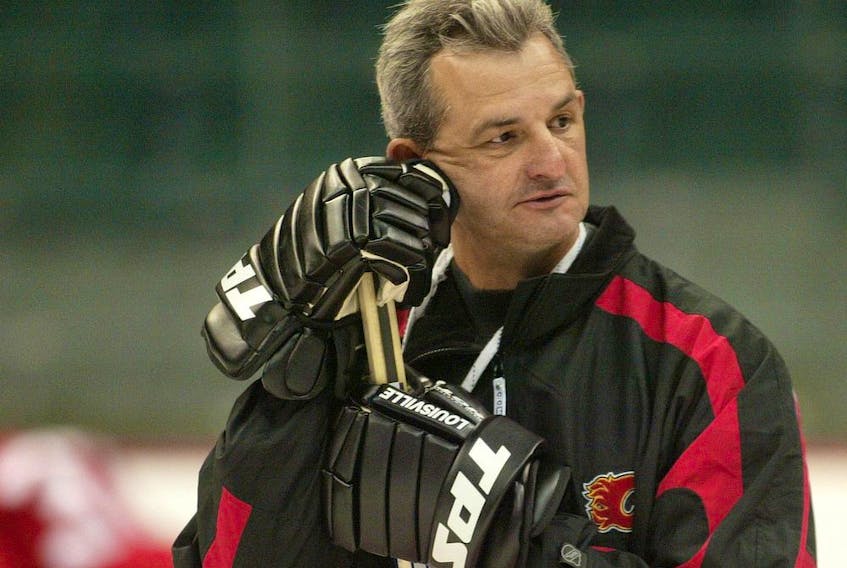 Calgary-09/12/03-Calgary Flames head coach and general manager Darryl Sutter looked on as plays were run during the opening day of on ice training camp for the 2003-2004 season at the Pengrowth Saddledome on Friday. Photo by Colleen Kidd/Calgary Herald (For Sports story by Scott Cruickshank) ************************************** Filter: No USM: No File Size: 8.04MB Original file name: 728F8776.JPG