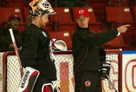  Then-Calgary Flames goalie coach David Marcoux talks with netminder Miikka Kiprusoff during a practice in 2006. Postmedia Network file