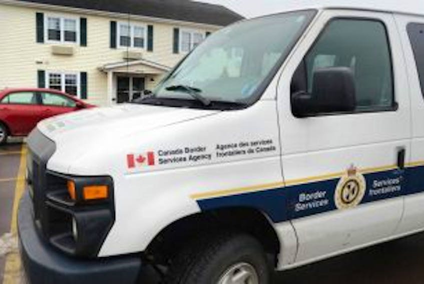 ['A Canada Border Service Agency vehicle spent much of the day Wednesday outside the Sherwood Inn and Motel in Charlottetown as agents searched for and removed documents from the premises.<br /><br />']