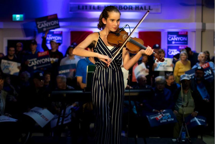 A fidler performs before the leader of Canada's Conservatives, Andrew Scheer, campaigns for the coming election in Little Harbour, N.S., on Thursday, Oct. 17, 2019.   