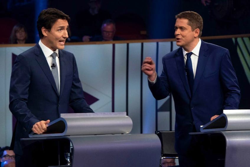 Liberal leader Justin Trudeau and Conservative leader Andrew Scheer face off in the leaders French language debate in Gatineau on Oct. 10. Here’s a bold claim: politicians aren’t solely to blame for the divisive, oppositional rhetoric we've been hearing during this campaign.