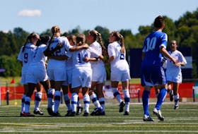 Team Nova Scotia celebrates Axewomen recruit Katie Ross (centre) goal on a penalty kick in their 5-1 win over Alberta Aug. 5 at the Canada Games.