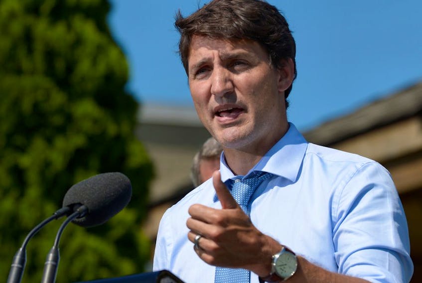 Prime Minister Justin Trudeau speaks about a watchdog's report that he breached ethics rules by trying to influence a corporate legal case.