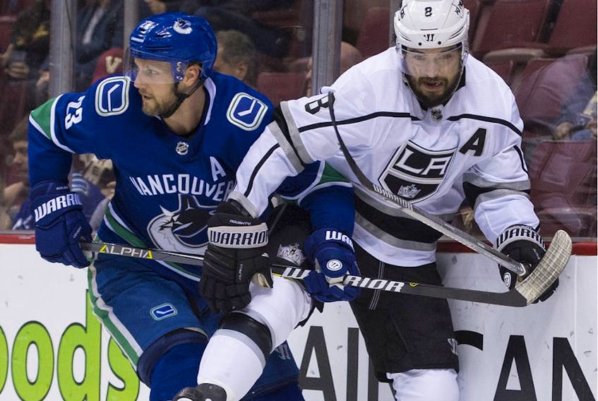 Alex Edler of the Vancouver Canucks collides with Los Angeles Kings' veteran Drew Doughty during NHL action at Rogers Arena last season.