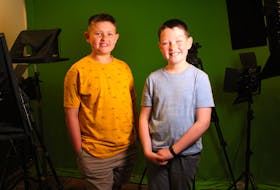 Ten-year-old Lucas Sakalauskas and his 11-year-old brother Liam stand in their home's television studio to shoot their ECK (East Coast Kids) News show during the COVID-19 stay at home orders in Nova Scotia. The show is filmed and edited by their father and received thousands of views on YouTube in March and April. Now the brothers have dropped the acronym and revamped East Coast Kids into a Cape Breton travel show. NICOLE SULLIVAN • CAPE BRETON POST 