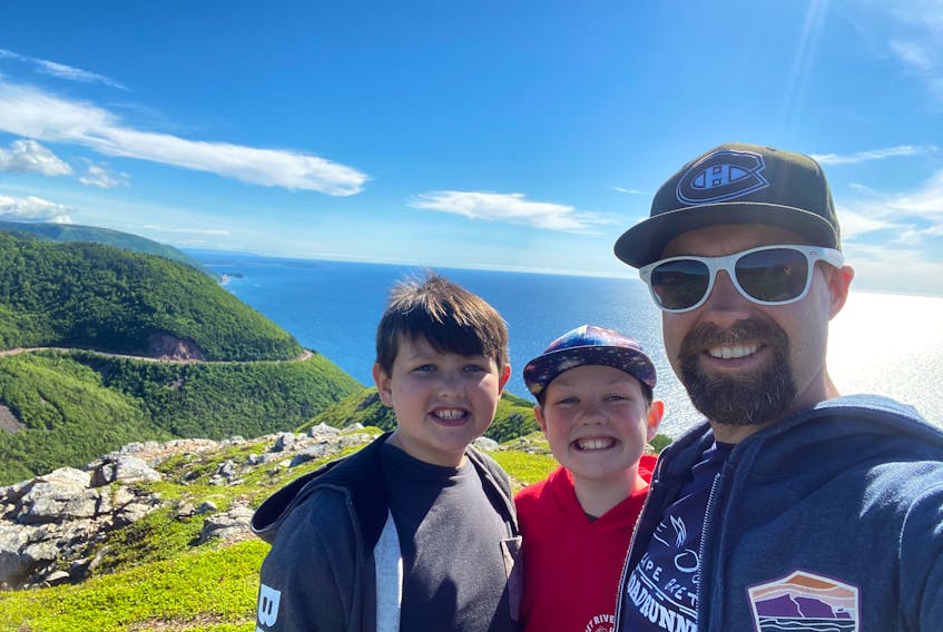 Herbie Sakalauskas and his sons 10-year-old Lucas, left, and 11-year-old Liam take a selfie at the Skyline Trail in the Cape Breton Highlands while filming an episode of East Coast Kids in July. The episode was a travel piece about the Cabot Trail and one of the videos the family submitted to Bell Canada officials who were interested in airing East Coast Kids. A deal has now been signed and Bell Canada is airing eight episodes of East Coast Kids, hosted by Lucas and Liam, which will be produced in the fall with the help of film/video production company NovaStream. The brothers, who live in Sydney River, hope the deal will lead to more travel episodes. NICOLE SULLIVAN • CAPE BRETON POST 