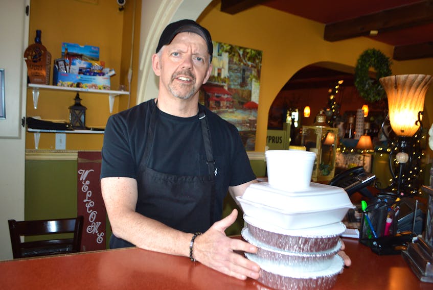 William Delaney, owner of The Olive Tree restaurant in Sydney, stands at the front counter of his restaurant on Victoria Road. Delaney said to help protect against the COVID-19 they are not only following government regulations and suggestions such as reducing seating to create a social distancing between tables but are now offering takeout. Sharon Montgomery-Dupe /Cape Breton Post
