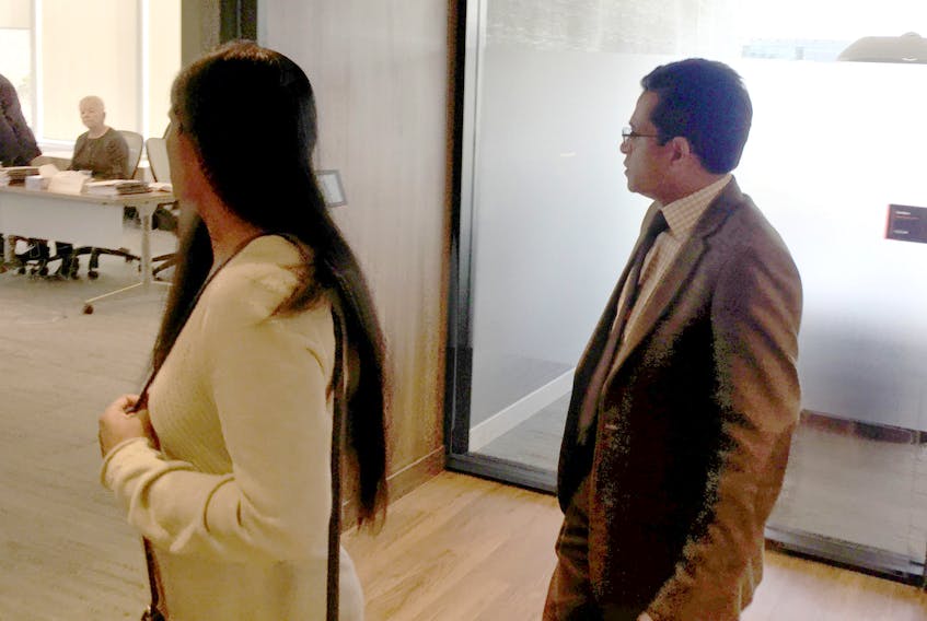 Dr. Manivasan Moodley follows his wife into a hearing at the Nova Scotia College of Physicians and Surgeons offices in Bedford on Monday, Feb. 24, 2020. Moodley, a Cape Breton doctor, faces allegations of professional misconduct from 2017 related to two patients. - Francis Campbell