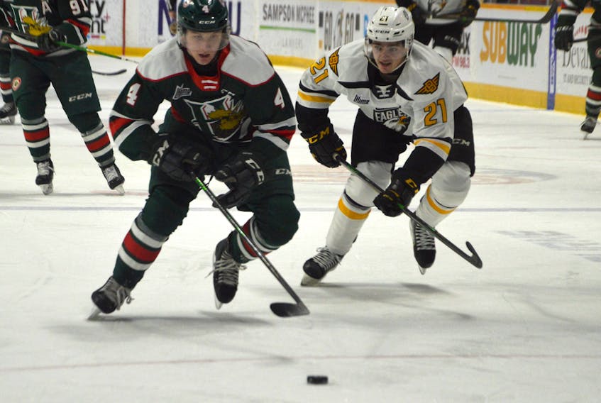 Jake Furlong of the Halifax Mooseheads, left, is chased by Liam Kidney of the Cape Breton Eagles during Quebec Major Junior Hockey League action at Centre 200 in Sydney earlier this month. Cape Breton will host Halifax today at 7 p.m. at Centre 200. JEREMY FRASER • CAPE BRETON POST