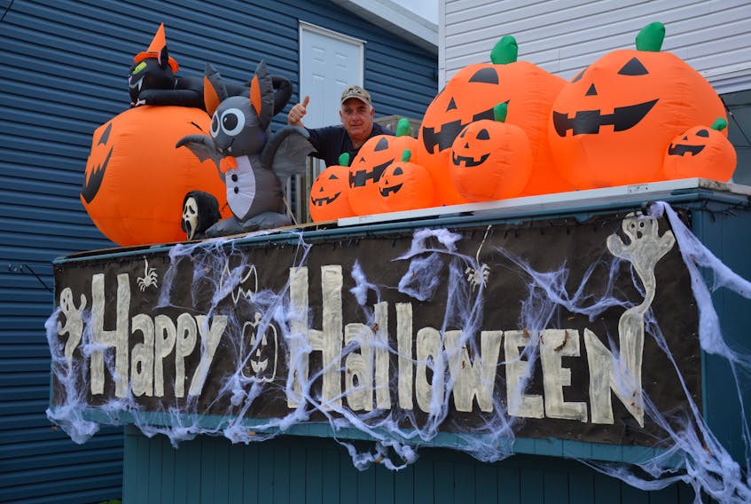 Sydney resident Wayne Hines stands amid his annual Halloween display at his home on Intercolonial Street as he and his neighbours prepare for a night of celebration on Saturday. The neighbourhood will be hosting a fireworks display at 8 p.m. and those planning on attending can also treat themselves to some hot chocolate. CAPE BRETON POST PHOTO