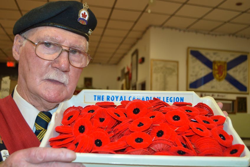 Doe McGrath, sergeant-at-arms for Branch 3 of the Royal Canadian Legion in Glace Bay, holds a tray of poppies. McGrath said they do have a member or veteran in some stores for the poppy campaign but all stores aren’t allowing them inside this year due to the pandemic and their legion doesn’t want their members standing out in the cold. Sharon Montgomery-Dupe/Cape Breton Post