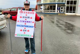 Darlene LeBlanc wore signs she's been making since the summer, hoping there would be a protest against mandated COVID public health directives in Cape Breton. NICOLE SULLIVAN/CAPE BRETON POST 