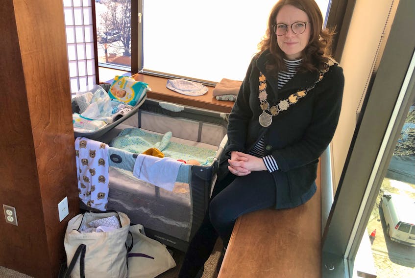 CBRM Mayor Amanda McDougall sits in her office on Monday next to a playpen in the back corner for her three-month old son, Emmett, when she takes him to work with her. NICOLE SULLIVAN/CAPE BRETON POST 