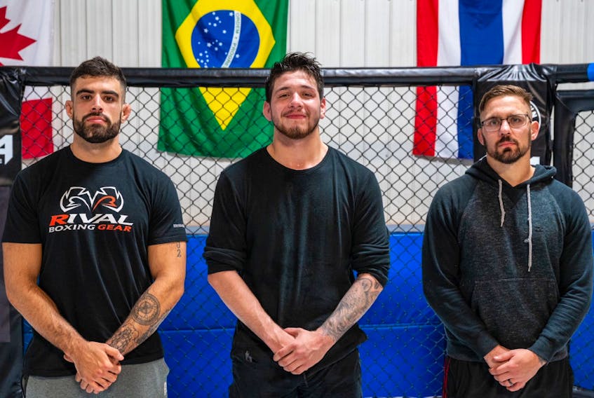 Three Cape Breton mixed martial arts  fighters recently took part in a Fight League Atlantic 16-person tournament at an undisclosed location. Justin MacKenzie and Colton Grant-hose both posted victories, while Drake Farrell won the event, taking home the championship ring. From left, MacKenzie, Farrell and Grant-hose. PHOTO SUBMITTED/JUSTIN MACKENZIE.