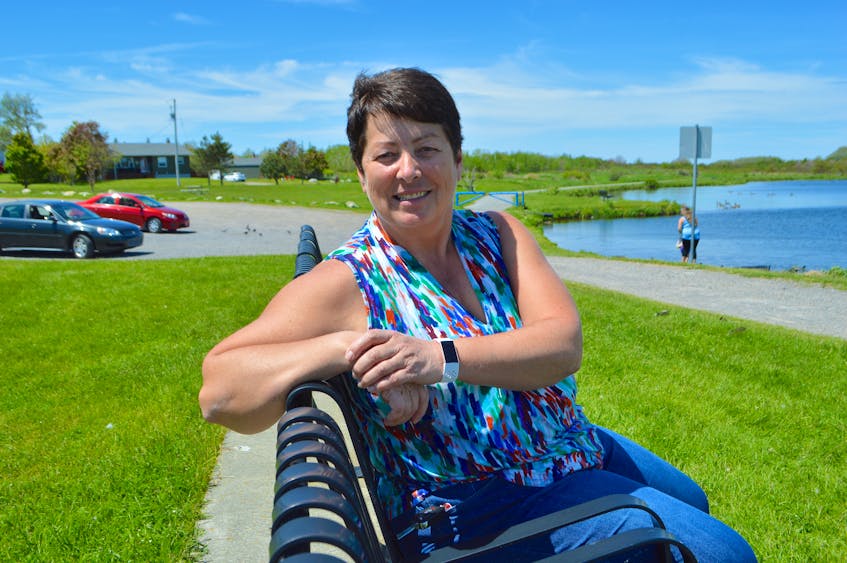 Charlene Hunter of Homeville relaxes at John Bernard Croak Memorial Park in Glace Bay, a spot she loves to bring her son John Hunter, 30, who is a resident of a group home for people with intellectual disabilities. Sharon Montgomery-Dupe/Cape Breton Post
