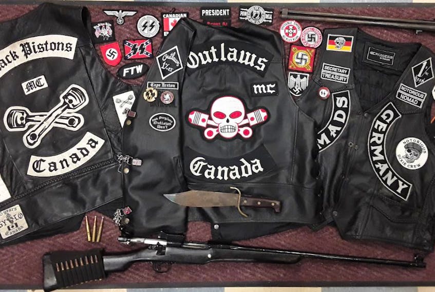 Cape Breton Regional Police have charged two additional individuals with weapon offences in connection with an investigation into the activities of motorcycle gangs in the area. Among the items seized was a full cut patch for membership in the Outlaws along with several other badges and paraphernalia. SUBMITTED PHOTO