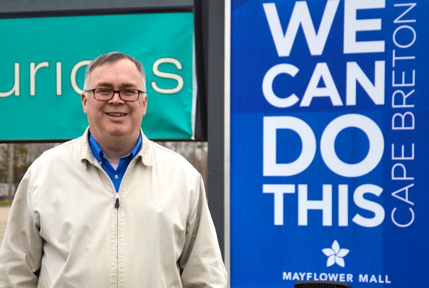 Greg Morrison, manager of Mayflower Mall, stands near the Sydney mall’s new sign, which encourages positivity during and post COVID-19. JEREMY FRASER/CAPE BRETON POST
