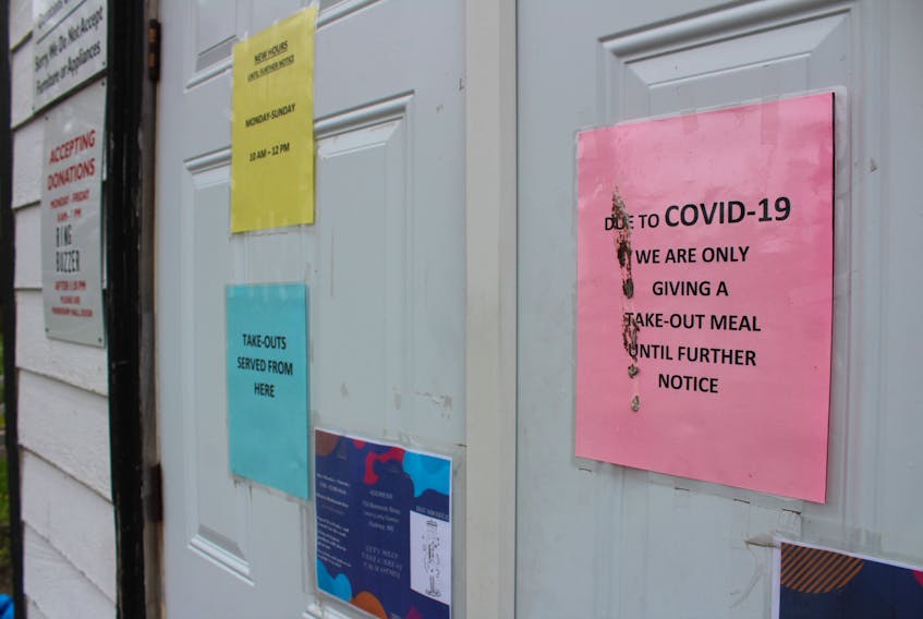 Signs on the front door of Loaves and Fishes in Sydney, informing people they are only providing takeout meals at this time, will remain a bit longer despite restrictions on public gatherings being relaxed. As of Friday, meal halls like this (sometimes called soup kitchens) can open to the public if they follow the same guidelines as restaurants. However, Loaves and Fishes is staying closed partly because the regulations might make their free meal delivery service more difficult since with social distancing they can only service one-third of the clients their dining room can seat. The Glace Bay Food Bank is also keeping its dining room closed until the restrictions, put in place to stop the spread of COVID-19, are lifted. NICOLE SULLIVAN/CAPE BRETON POST 
