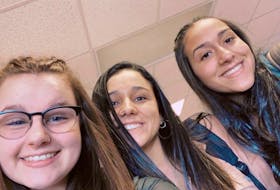 From left, Hannah MacDonald from Marion Bridge snaps a selfie with friends Isidora Perinetti and Mariana Xavier at Riverview High School last semester before the COVID-19 pandemic led to stay at home orders and online learning for the rest of the term. CONTRIBUTED