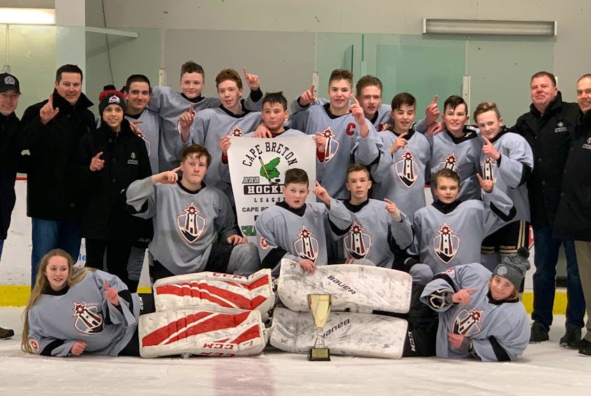 In March, the Cape Breton West Islanders captured the bantam ‘AA’ Cape Breton Cup, defeating the Cape Breton County Islanders 3-1 at the Al MacInnis Sports Centre in Port Hood. The Islanders were scheduled to host the bantam ‘AA’ provincial championship, but it was cancelled due to COVID-19. Front row, from left, are Anna MacNeil and Dan Morrison. Middle row, from left, are Kenzie Batherson, Luke MacEachern, Jeremy MacDougall and Owen Heukshorst. Back Row, from left, are Mark MacIntyre (assistant coach/manager), Brent MacEachern (head coach), Von Paul, James Murphy, Campbell MacIntyre, Johnathan Dunphy, Blake MacDonnell, Colin van Zutphen, Drew MacLean, Russell MacDonald, Cam MacLean, Ethan MacLean, Harvey van Zutphen (assistant coach) and Kristen Heukshorst (assistant coach). PHOTO SUBMITTED/MARK MACINTYRE 