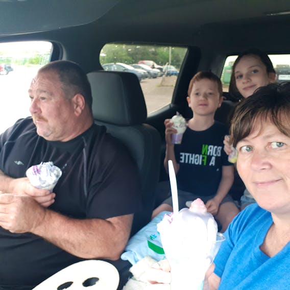 The Navarole family snapped a photo after after getting their unicorn sundaes from Bayside Drive-In, a limited edition treat which is helping raise money for their cause. One dollar from the sale of each sundae is being donated to the Capers and Friends team, which is participating in the Make-a-Wish Foundation's Rope for Hope in Halifax on Oct. 3. Back, 12-year-old twins Deven and Dasha; front, parents, Bernie and Nadine. CONTRIBUTED 