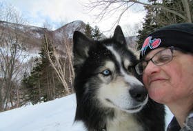 Arlene Fougere having an affectionate moment with her husky Cooper at home in Meat Cove. Fougere said it’s frustrating as there still hasn’t been a decision into a complaint she laid with the Nova Scotia Veterinary Medical Association after her dog was euthanized by mistake eight months ago. CONTRIBUTED