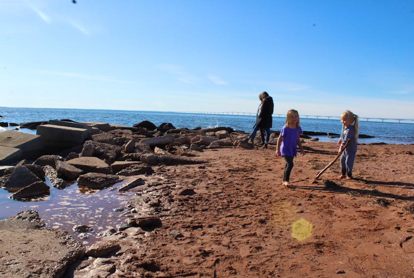 The Cape Traverse Ice Boat Crew hosted a public meeting Monday night, to discuss a potential cleanup of the local public beach. Robyn MacKay and Sharon Kamperman surveyed the shoreline at the beach in question recently while their children Elliott MacKay and Sylvia Cutcliffe played nearby.