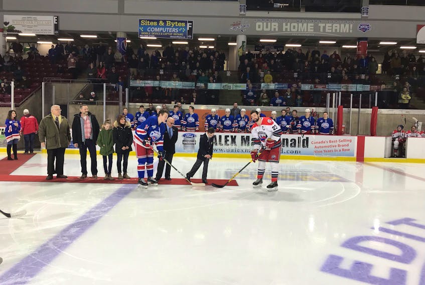 Easter Seals Ambassador Tyler MacLeod of Summerside dropped the puck for the ceremonial opening faceoff for Monday afternoon’s MHL (Maritime Junior Hockey League) game between the Summerside Western Capitals and South Shore Lumberjacks. Also taking part in the faceoff are Rotarian Bill Martin, a member of the organizing committee of Monday’s event; Tyler’s parents, Brian and Shelley and sister Tori, and Summerside Mayor Basil Stewart. The Caps donated the team’s share of Monday’s 50/50 draw to the Easter Seals Campaign.