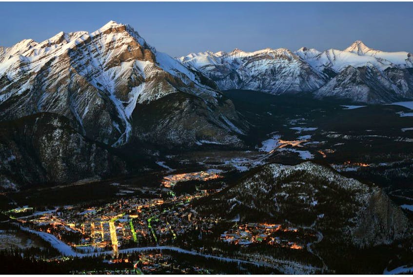 View of Banff at dusk from the upper terminal at the Banff Gondola.