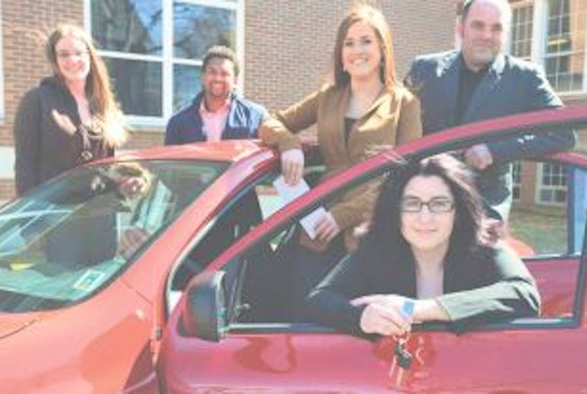 ['<p>Tara Maddix, first-year business Administration student at Holland College, holds the keys to her new Nissan Micra. The four runner-ups are from left, Nicole Christiansen, Nathan Lynde, Jillian Curley and David Andrew MacKenzie, who each earned $1,000.&nbsp;</p>']