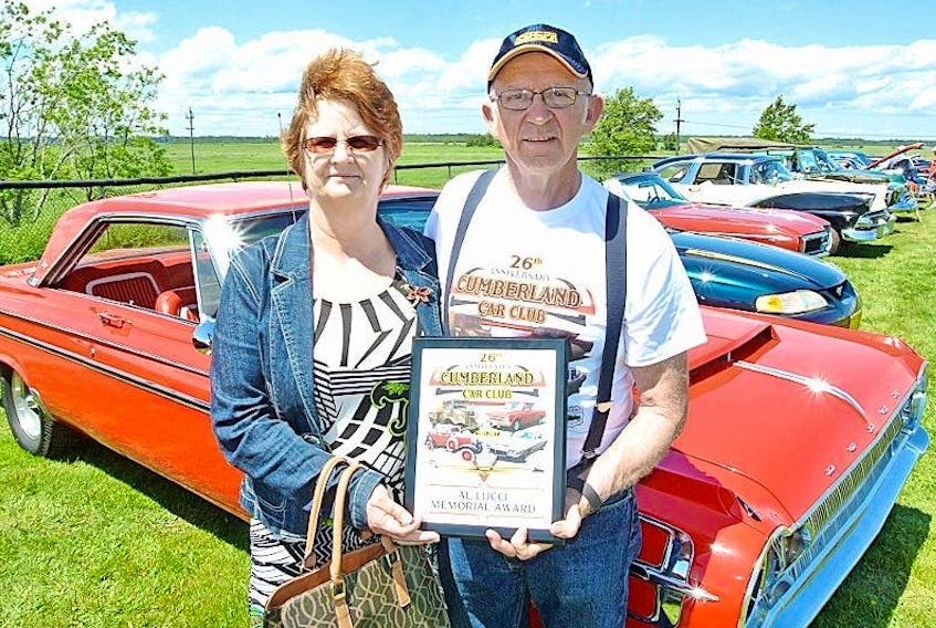 Naomi Lamb presents the first Al Lucci Memorial Award to Floyd Dickie at the Cumberland Car Club’s 26th annual show at the Robb Complex on Sunday.