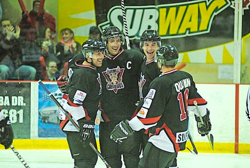 The Clarenville Caribous, from left, Martin Lapointe, Dustin Russell, Matthew Thomey and Matt Quinn celebrate Russell’s goal 4:05 into the first period, staking the home team to a 1-0 lead on New Brunswick in the Allan Cup Canadian senior hockey championship Monday in Clarenville. The ‘Bous went on to collect a 5-1 win.