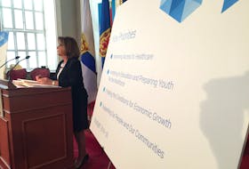 Nova Scotia Finance Minister Karen Casey talks to reporters about the newly released provincial budget at Province House on Tuesday, March 26, 2019.