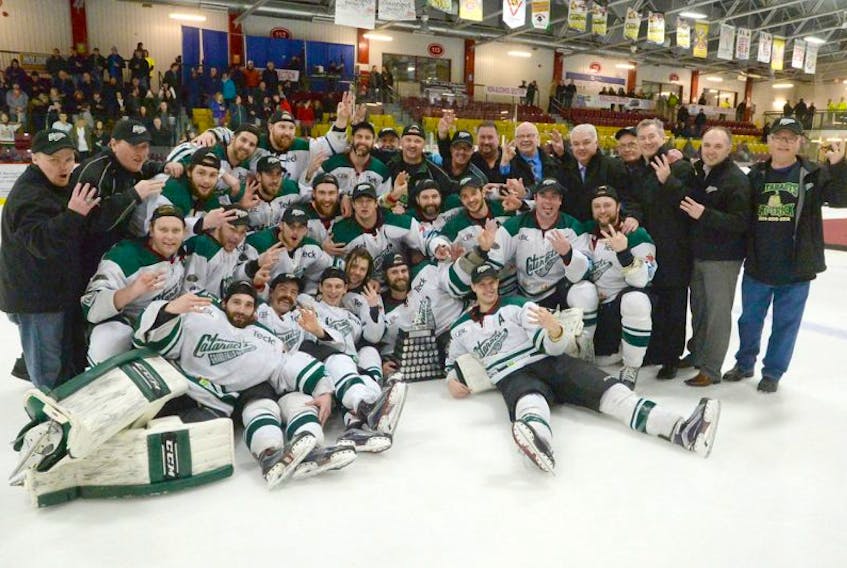 Members of the Grand Falls-Windsor Cataracts hold up three fingers to signify their winning a third straight Herder Memorial Trophy and Newfoundland and Labrador senior hockey championship after defeating the St. John’s Caps 10-1 at Jack Byrne Arena in Torbay Friday night. The Cataracts took the best-of-five Herder series in three games.