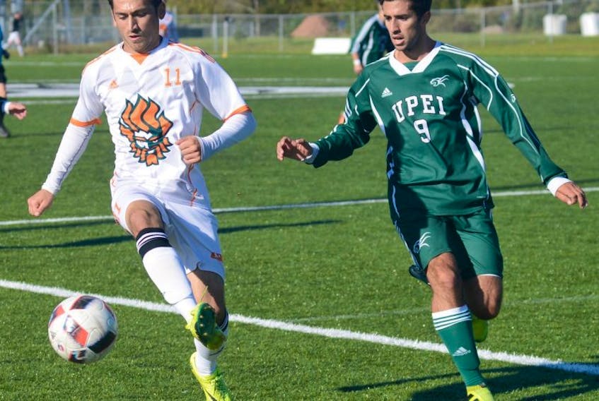 Capers midfielder Caelann Budhoo keeps the ball away from UPEI’s Ignacio Sanchez during Atlantic University Sport soccer action on Sunday in Charlottetown. The CBU men defeated the Panthers 2-1, while earlier in the day the Capers women upended their UPEI opponents 5-1. Both CBU teams are undefeated this season.