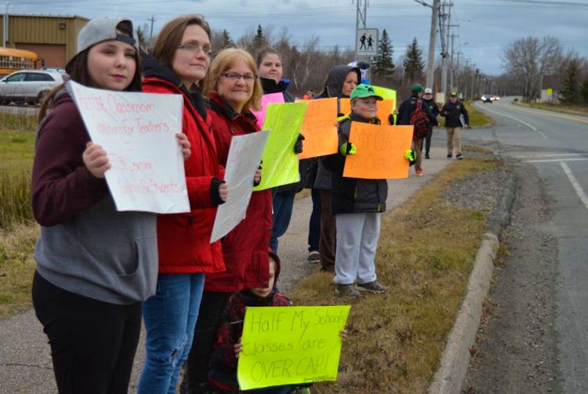About 50 students were joined by several parents on the sidewalk in front of TL Sullivan Elementary in Florence Thursday afternoon, calling on the province to meet teachers' demands as they prepare to start job action by working to rule beginning Monday.