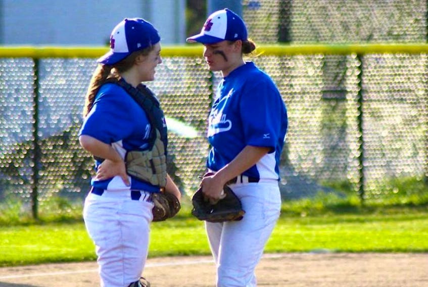 In this file photo, Sam Shupe, right, chats with fellow teammate Jenna Jackson during the Baseball Canada 21U women’s national invitational championships. Shupe, a New Waterford native, captured the bronze medal with Team Nova Scotia at this year’s tournament in Stonewall, Man., last Sunday.