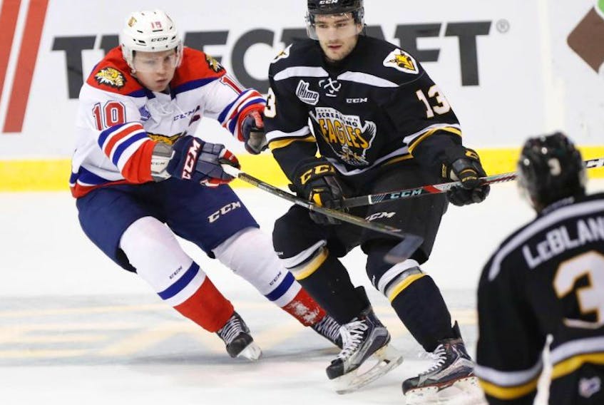 Giovanni Fiore, centre, scored a league-high 52 goals to lead the Cape Breton Screaming Eagles to a seventh-place finish in the QMJHL. Fiore scored two goals on Saturday as the Eagles wrapped up the regular season with a 5-1 win over the Moncton Wildcats. Fiore, shown here in action against the Wildcats' Duncan MacIntyre, and his teammates will open the playoffs at home on Friday against the Gatineau Olympiques in a best-of-seven series.